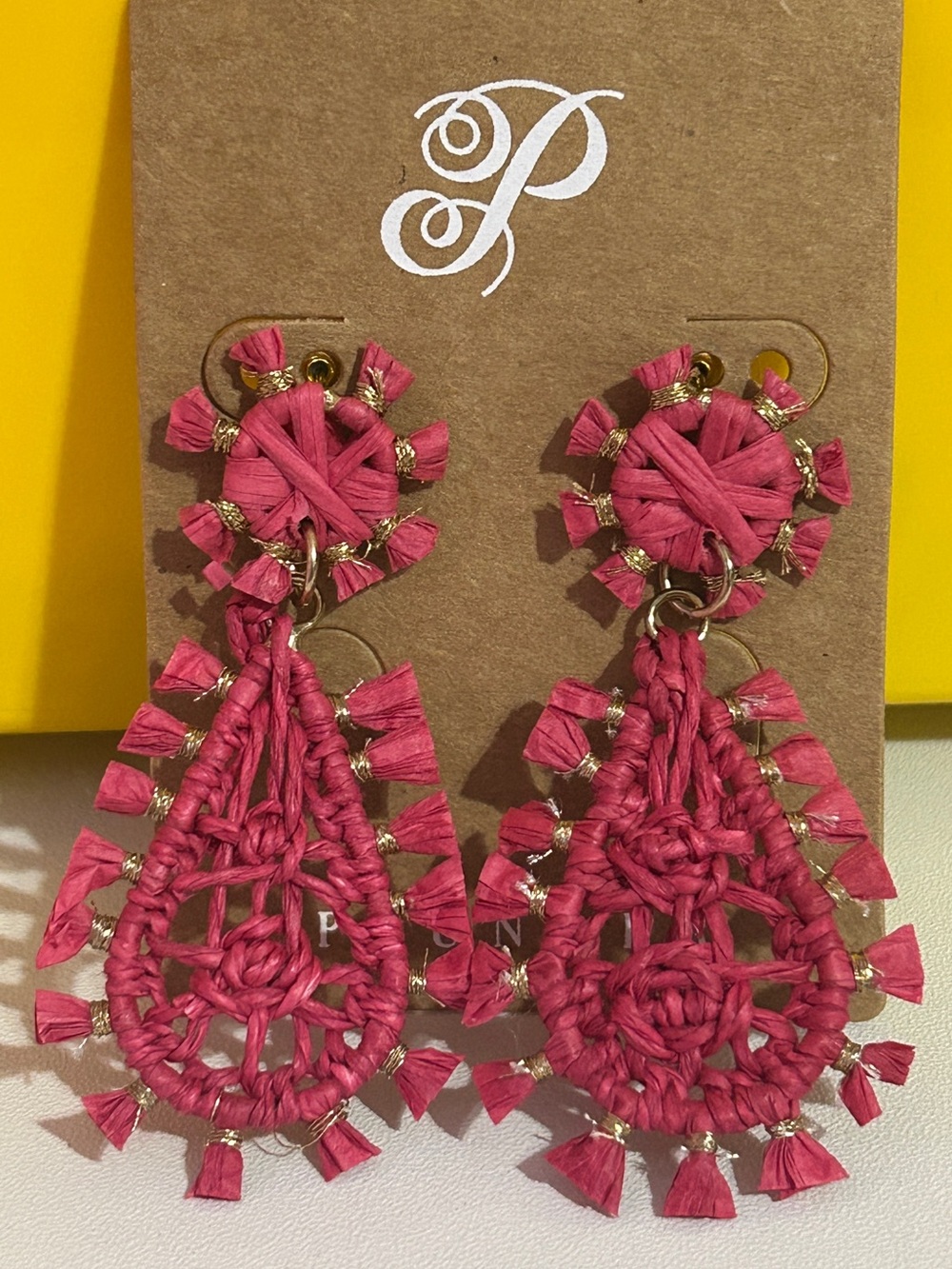 Plunder pair of hot pink woven raffia statement drop earrings.